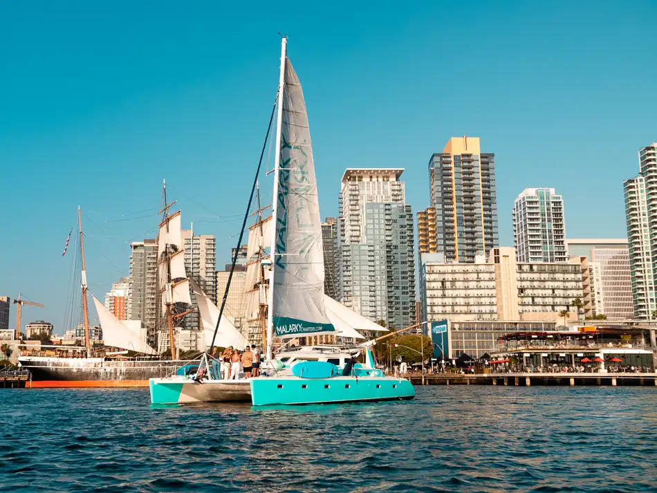 Malarky 47ft Voyage sailing catamaran under sail with downtown San Diego skyline behind
